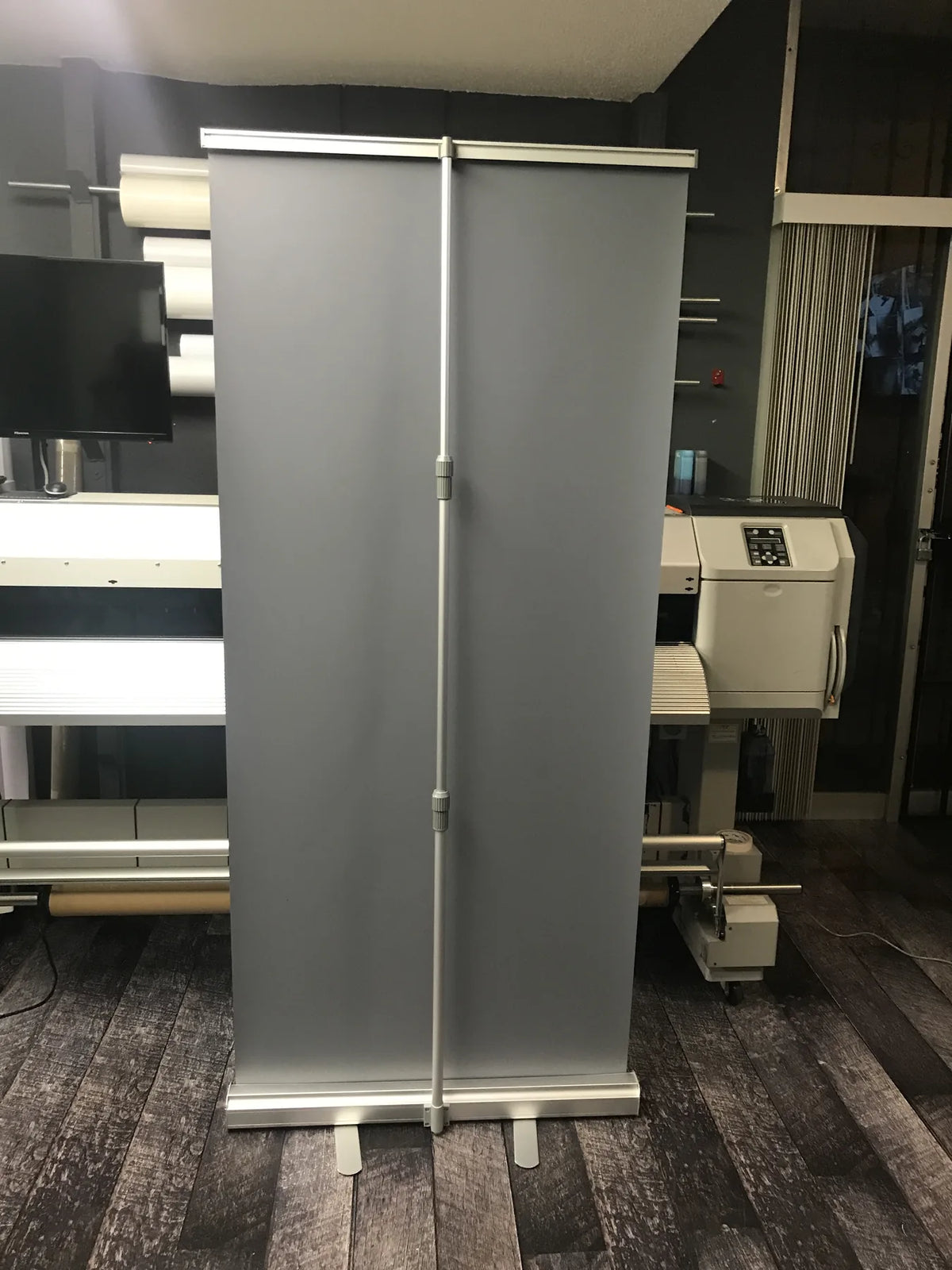 33 x 81 inch retractable roll-up banner stand with aluminum base and support pole at Urban Tee LLC in South Gate, CA