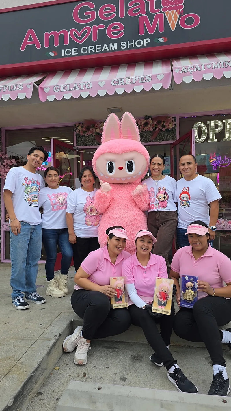 Ice cream shop team and their mascot outside the store in matching custom company t-shirts by Urban Tee LLC