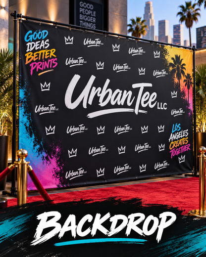 Custom step and repeat backdrop banner with Urban Tee LLC logos on a stand at a red carpet event in Los Angeles