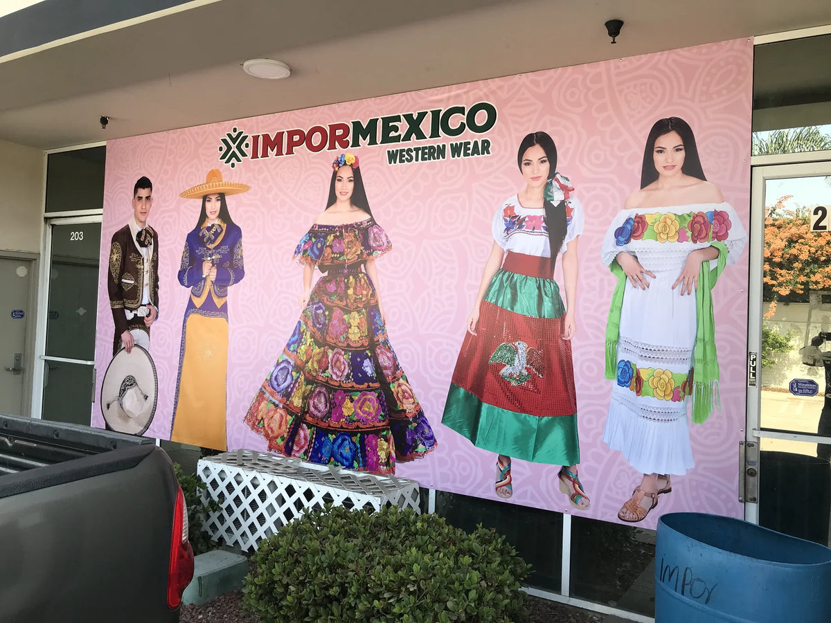 Large custom vinyl banner covering a western wear storefront, installed outdoors in the Los Angeles area