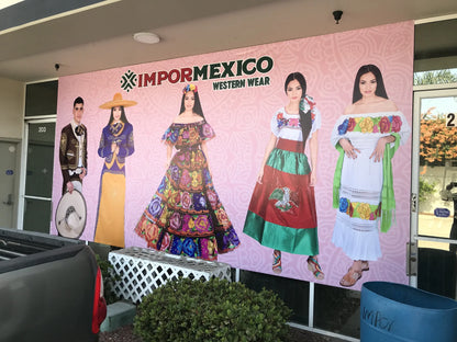 Large custom vinyl banner covering a western wear storefront, installed outdoors in the Los Angeles area