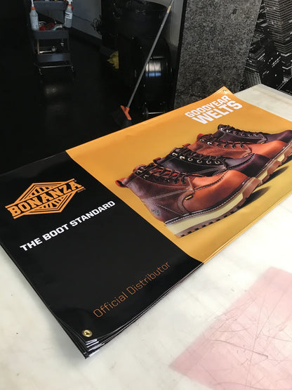 Custom vinyl banners with metal grommets for a work boot distributor, printed by Urban Tee LLC in Los Angeles