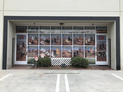 Custom window perforation graphics covering a western boot store storefront, printed by Urban Tee LLC near South Gate, CA